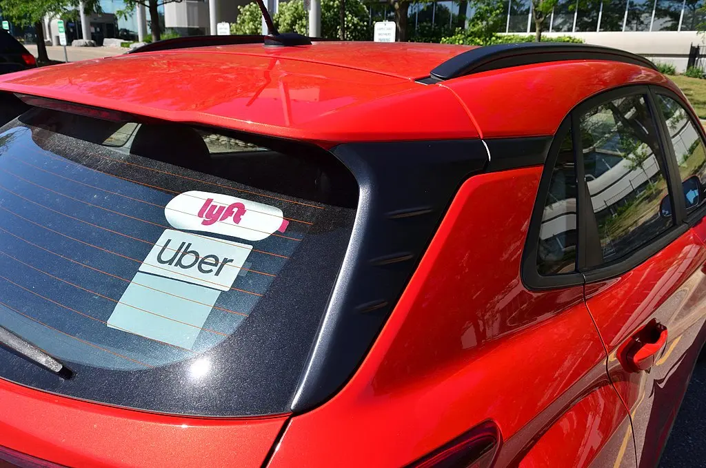 Photograph of red rideshare car by Raysonho @ Open Grid Scheduler / Scalable Grid Engine, CC0, via Wikimedia Commons.
